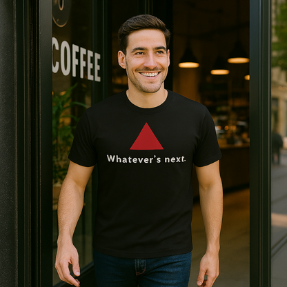 Model wearing a black t-shirt with a red triangle and text, outdoors.